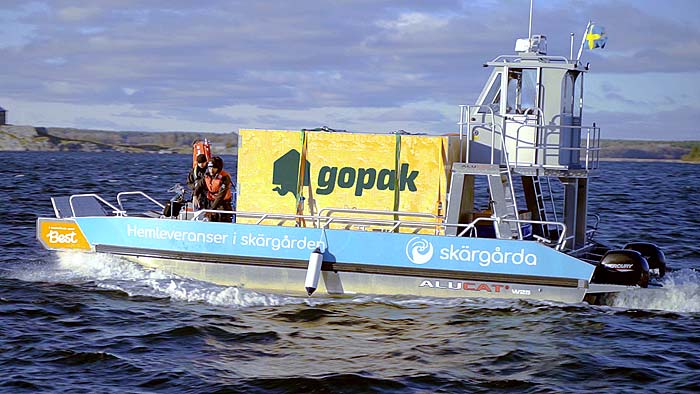 Skärgårda transporterar en Gopak över havet